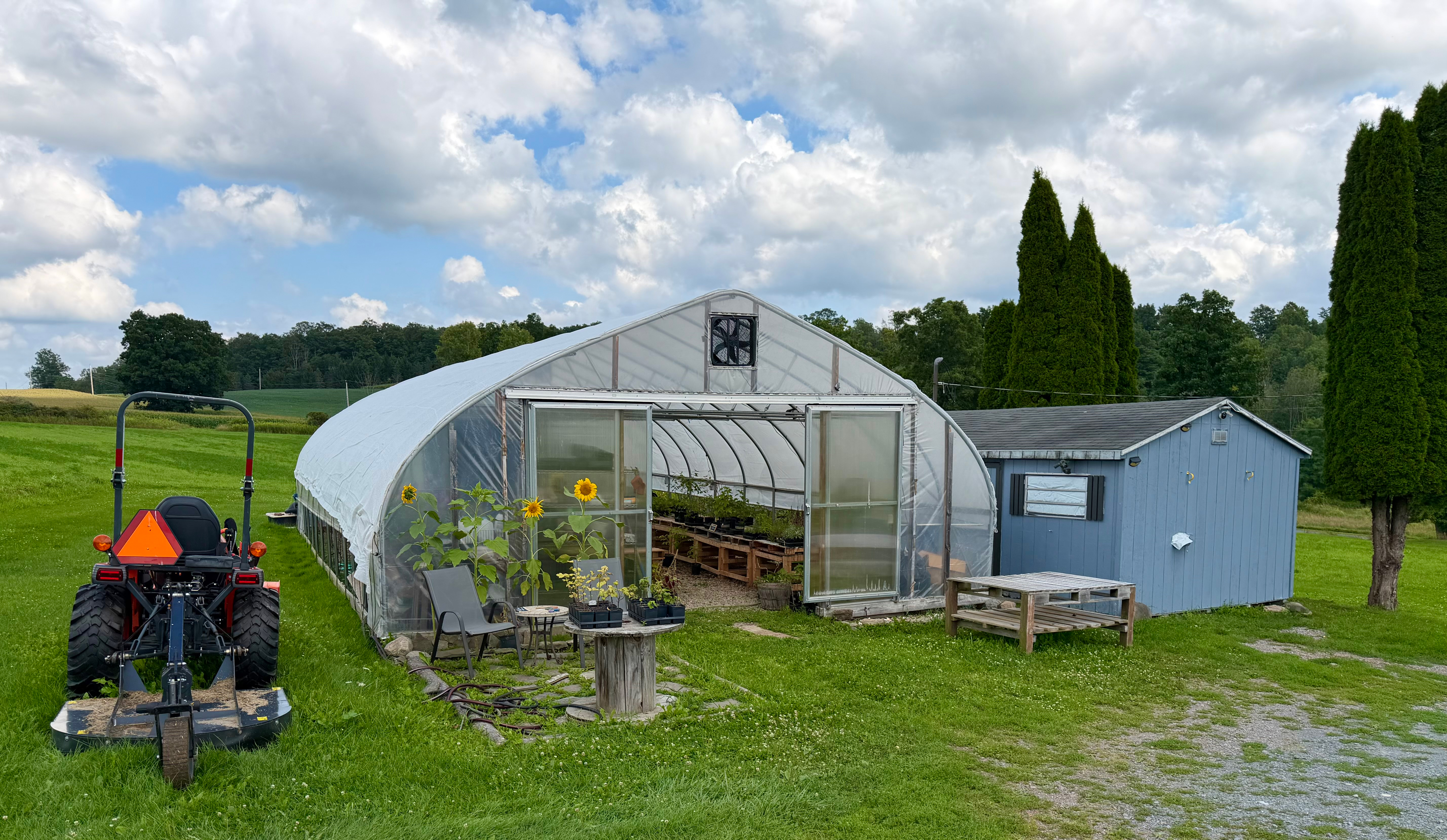 Outdoor nursery growing benches under shade cloth in Wellsboro